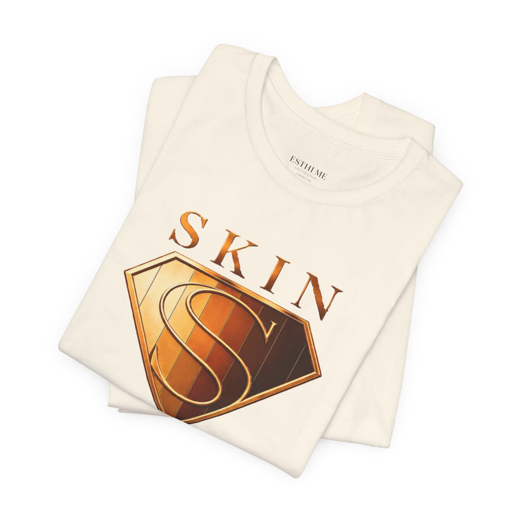 Folded cream Skin Girl™ t-shirt featuring the signature shield logo representing confidence, skincare, and barrier protection.