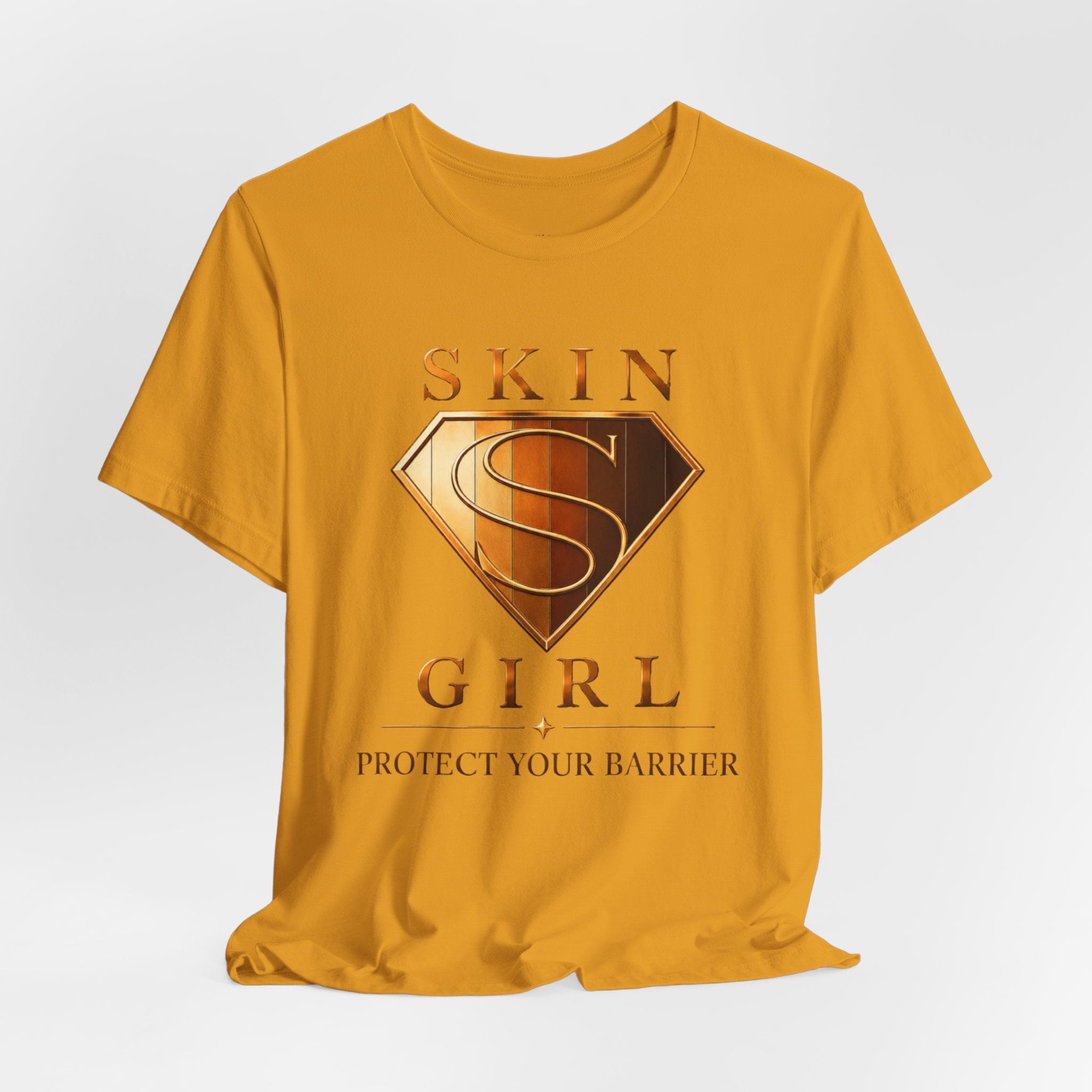 Golden yellow Skin Girl™ t-shirt featuring the shield logo and skincare empowerment message.