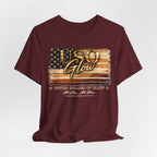 Burgundy unisex t-shirt featuring the United Shades of Glow™ graphic celebrating beauty professionals and skin confidence across all shades.