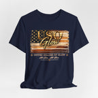 Navy blue unisex t-shirt with the United Shades of Glow™ design showcasing an American flag-inspired beauty graphic.